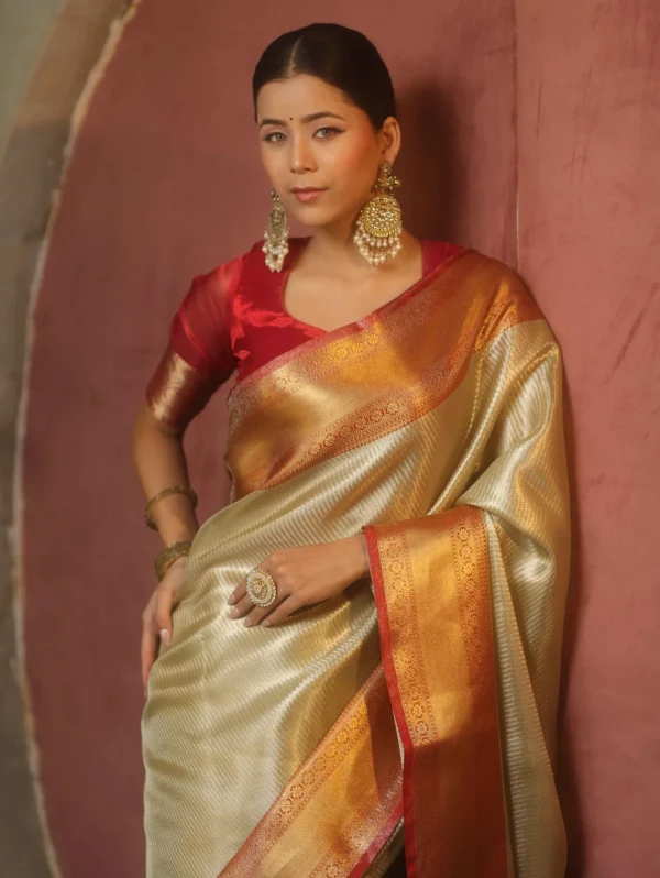 Tissue Kanjivaram Silk Saree in Gold with Red Zari Border